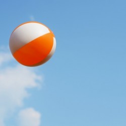 Beach ball on top of cloud